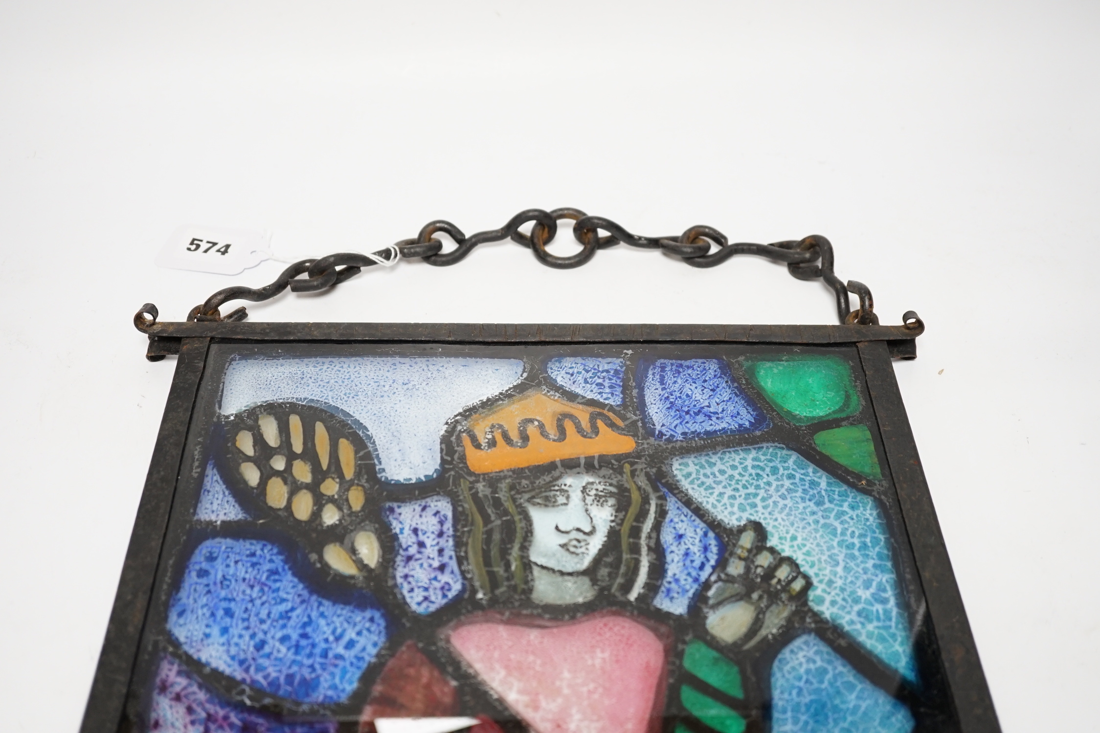 A rectangular wrought iron framed stained glass panel, 44x36cm total